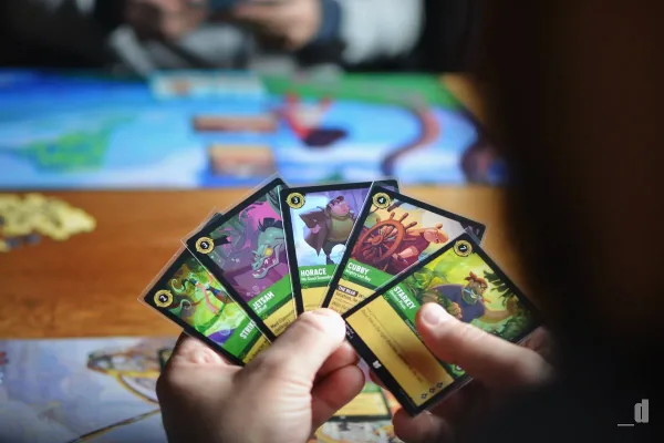 A fanned hand of Disney Lorcana cards
